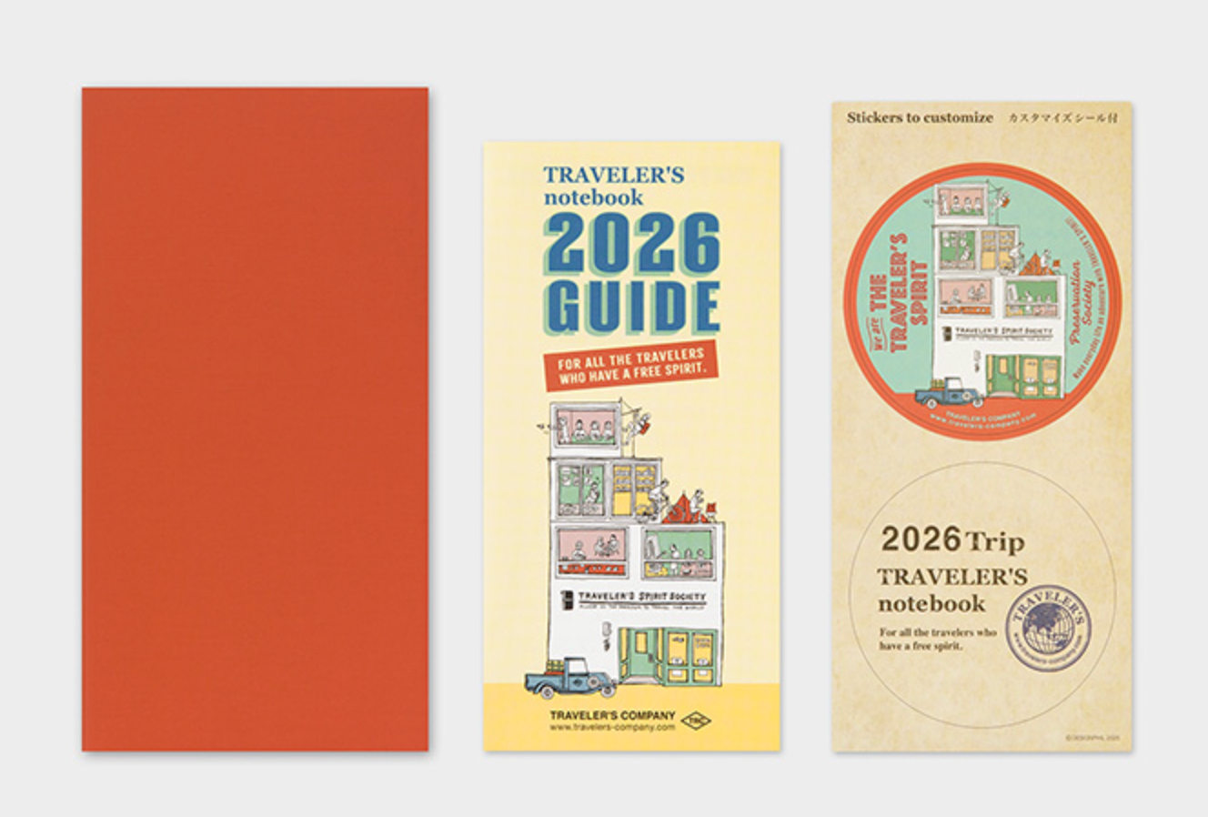 Traveler's Company notebooks and stickers on a white background