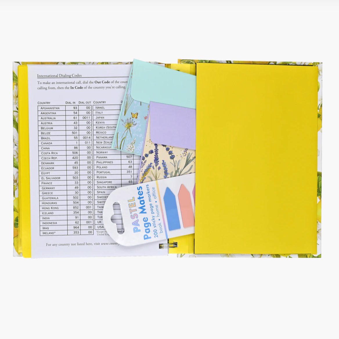 Open planner showing various pages with colorful designs and text on a white background