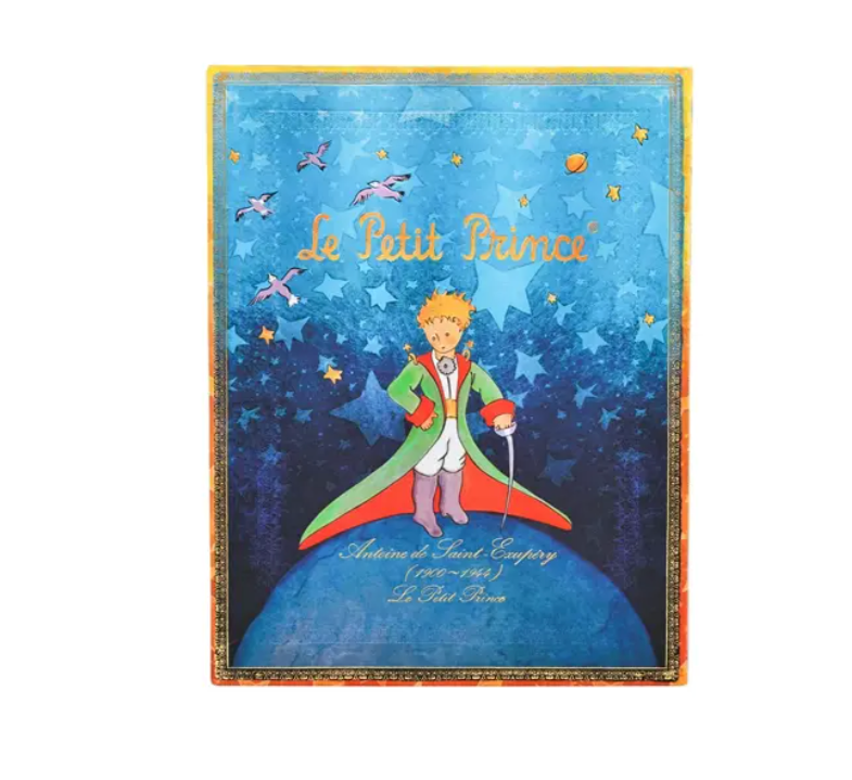 Illustrated book cover of 'Le Petit Prince' with a character on a planet against a starry sky.
