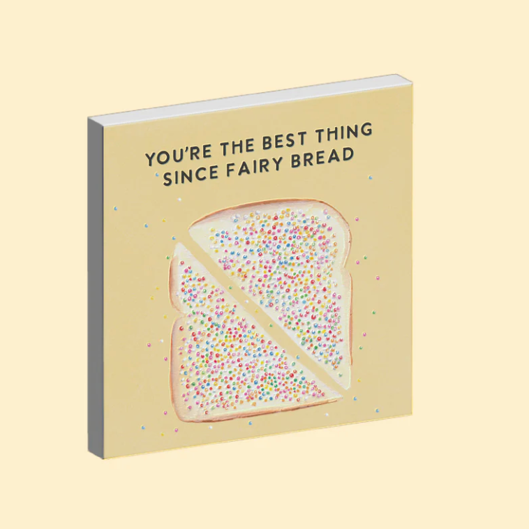 Magnet with a design of fairy bread and text on a beige background