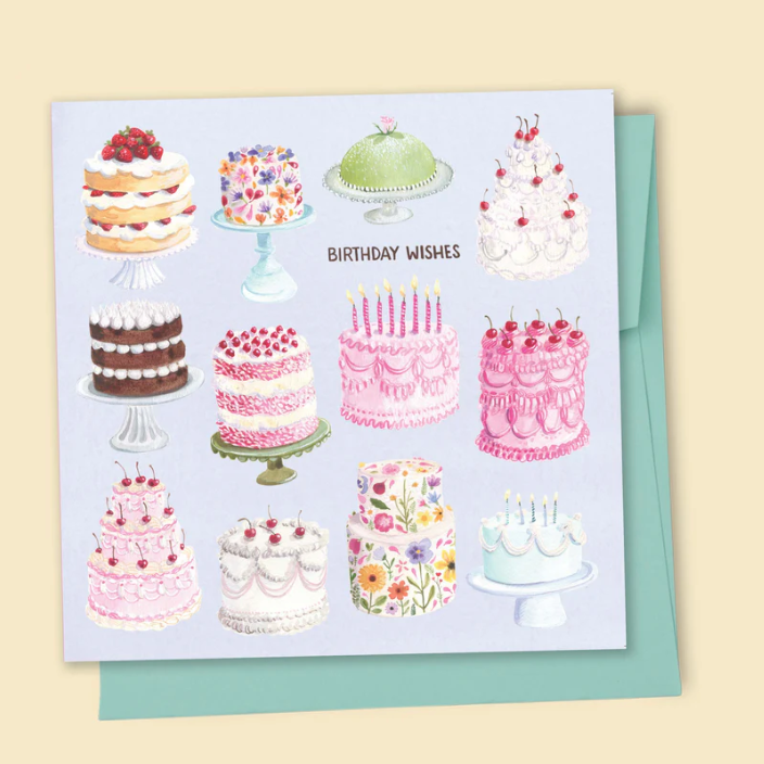 Greeting card with illustrations of various cakes and a green envelope on a beige background