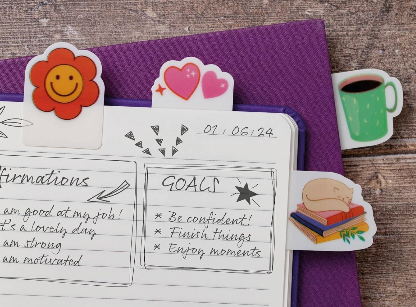 Notebook with stickers on a wooden surface