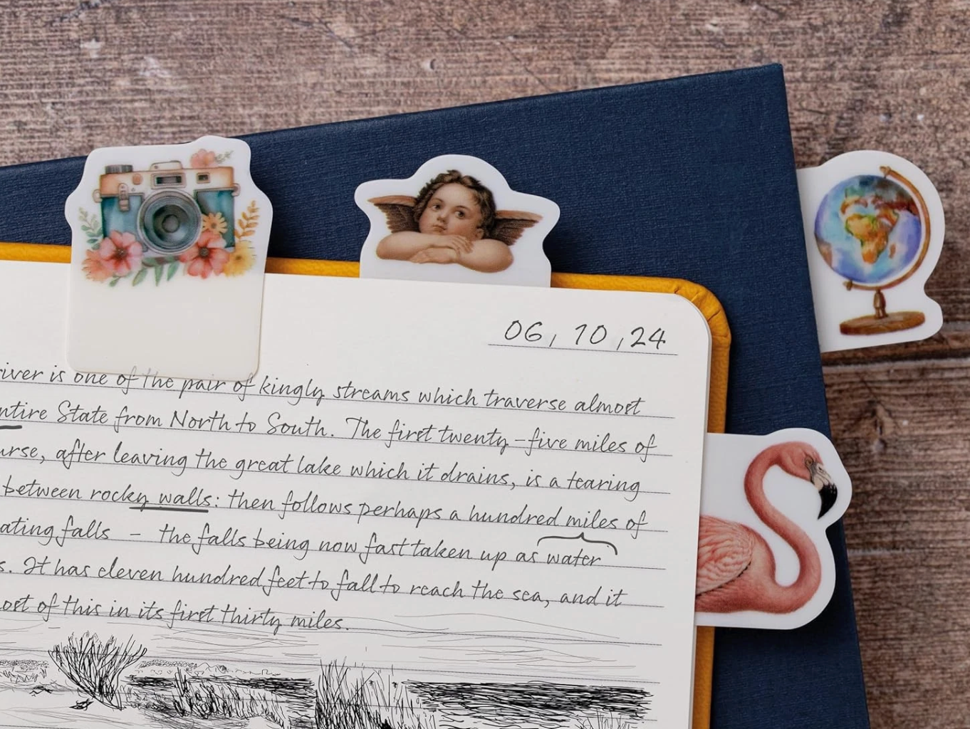 Notebook with decorative stickers on a wooden surface