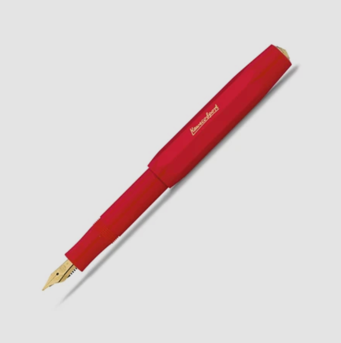 A red fountain pen with a gold nib and gold script logo on the barrel, photographed diagonally on a light gray background.