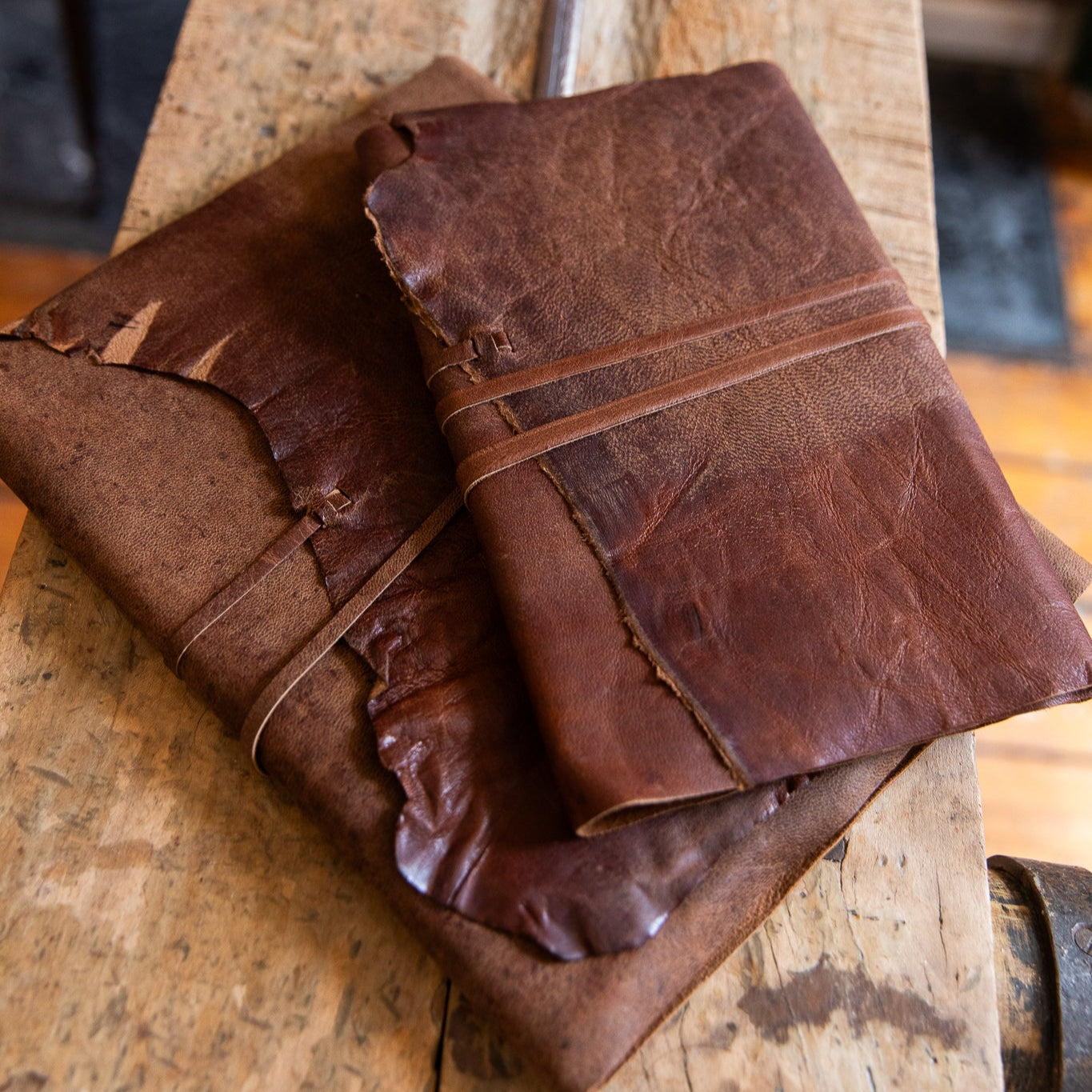 Brown leather-bound book on a wooden surface