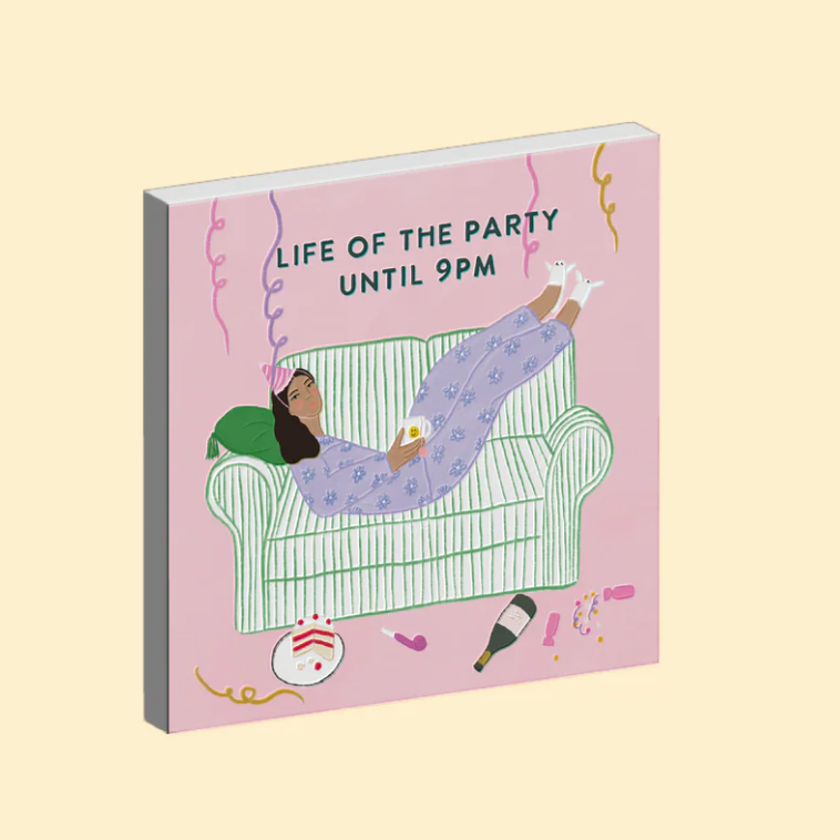 Ceramic magnet with illustration of a person lounging on a couch and text 'Life of the Party Until 9PM' on a pink background.