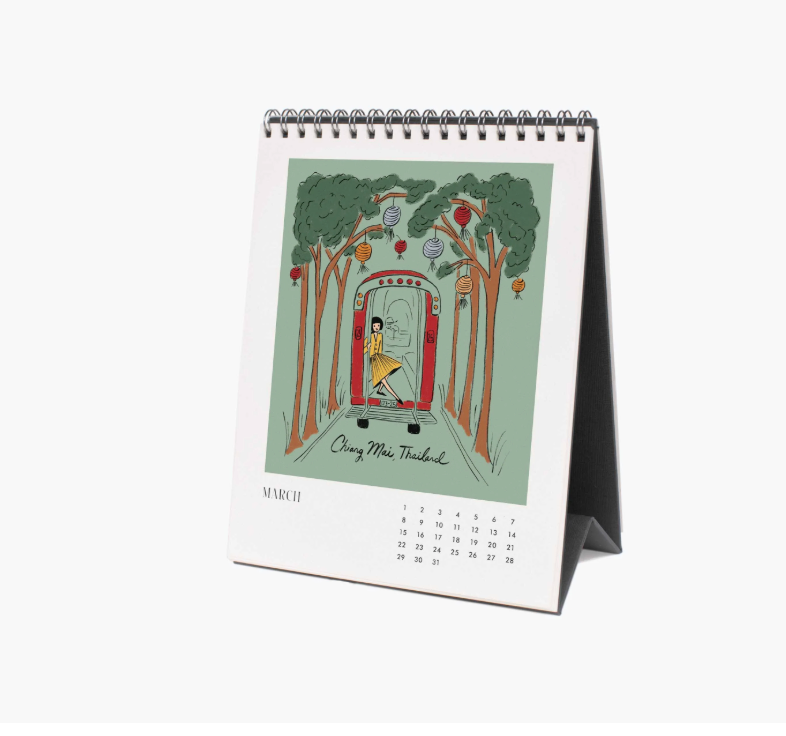 Desk calendar with a colorful illustration on a white background