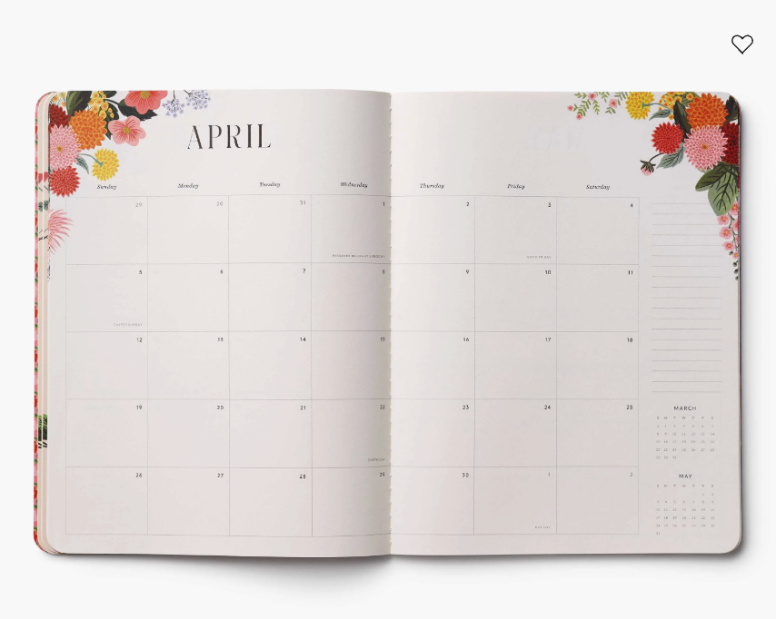 Open planner showing April with floral design on the cover