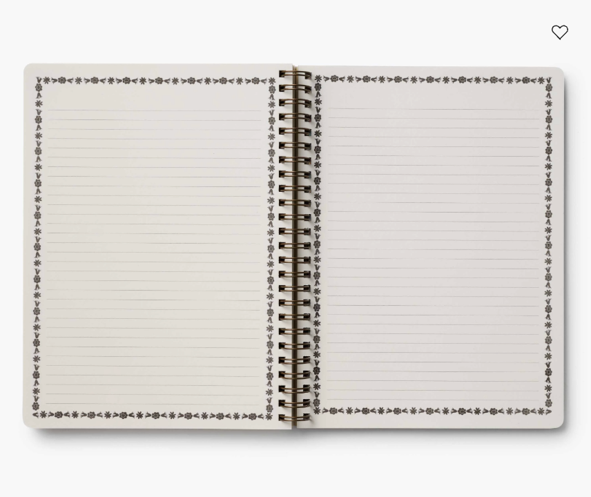Open spiral-bound notebook with lined pages on a white background