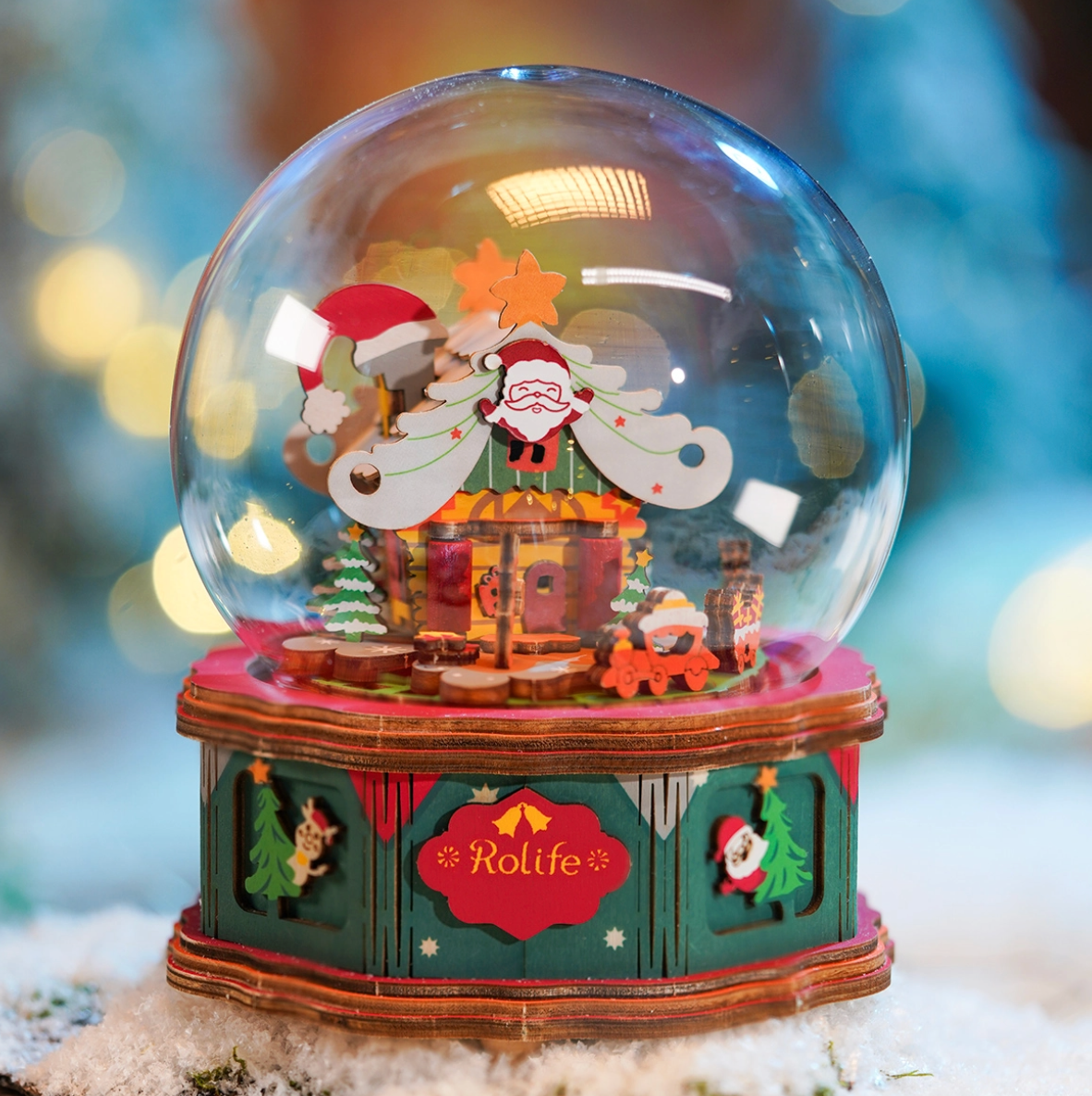 Decorative snow globe with Santa Claus and reindeer design, featuring the brand 'Rolife'.