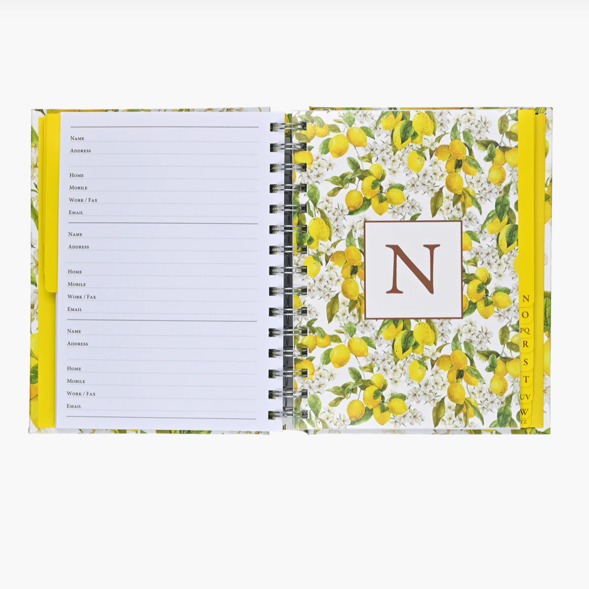Notebook with lemon pattern and monogram 'N' on a white background