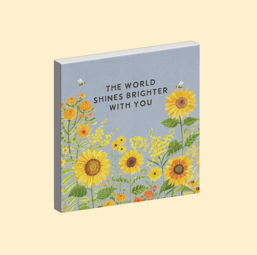 Magnet with floral design and text on a beige background