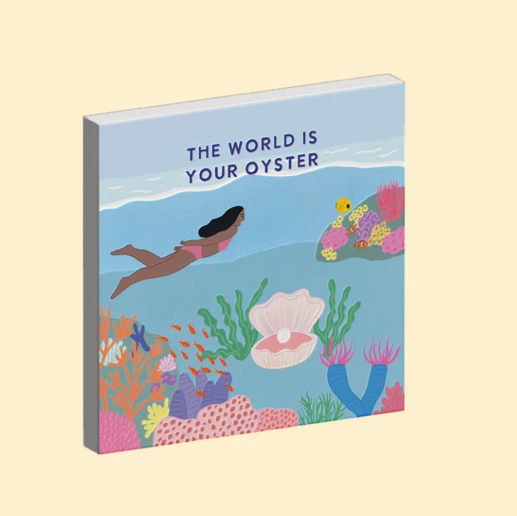 Ceramic Magnet with an underwater illustration and 'The World is Your Oyster' text on a beige background