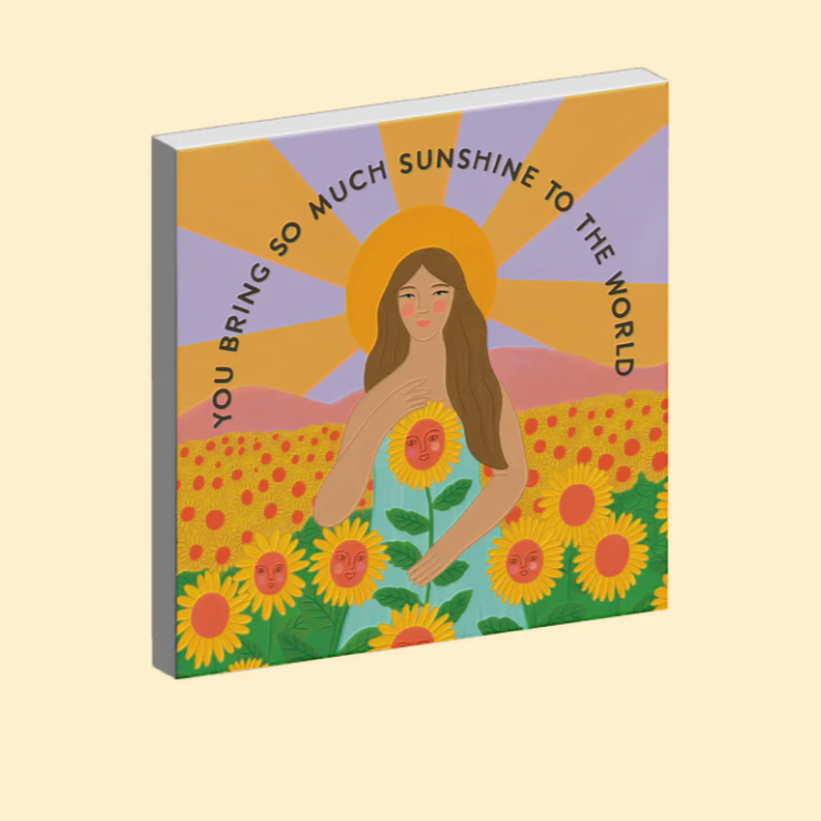 Ceramic Magnet with a woman surrounded by sunflowers and text on a beige background