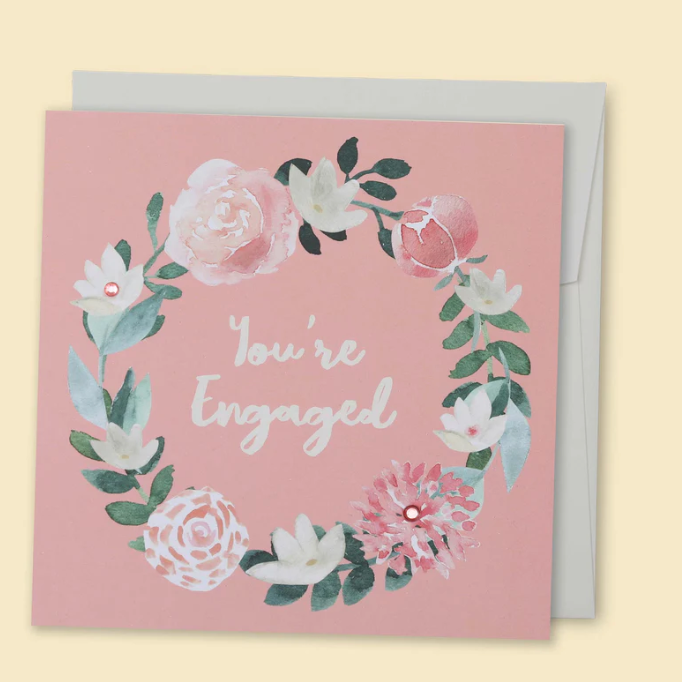 Card with floral design and 'You're Engaged' text on a pink background