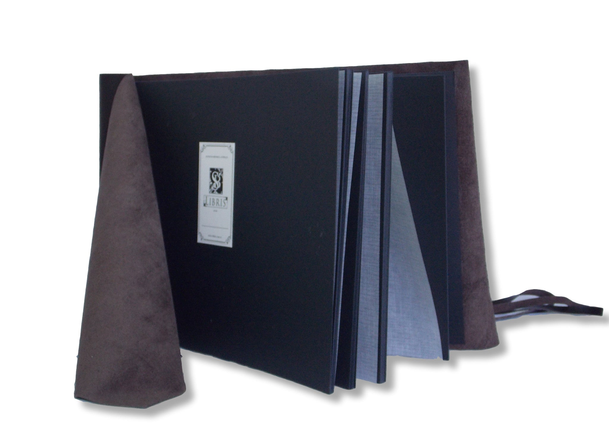 black pages inside leather wrap photo album