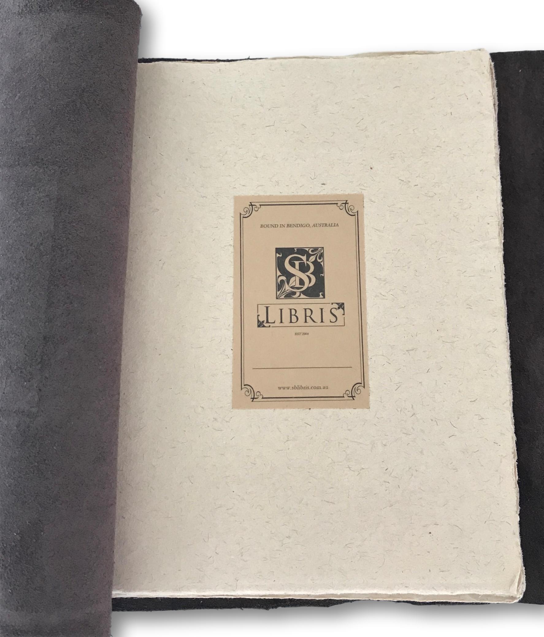 Handmade pages and bookplate inside journal