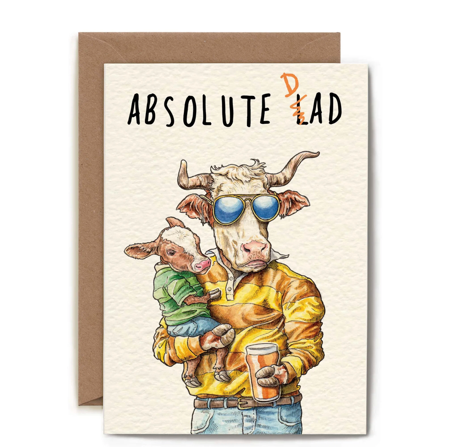 A greeting card with a brown envelope, featuring a watercolor-style illustration of a cow wearing blue sunglasses, holding a calf and a drink, with the text 'ABSOLUTE LAD' on a white card background.