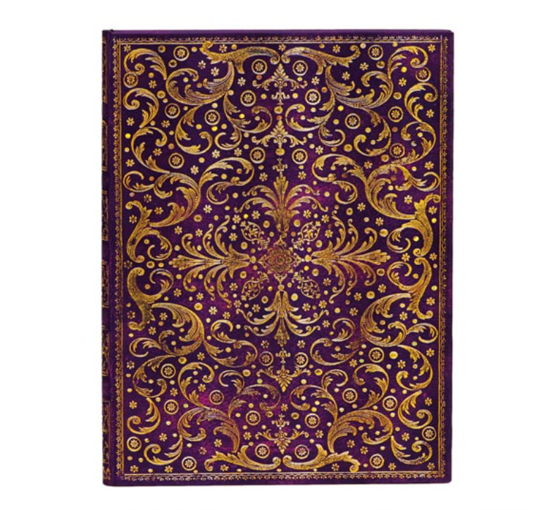 Decorative notebook with gold intricate patterns on a purple background