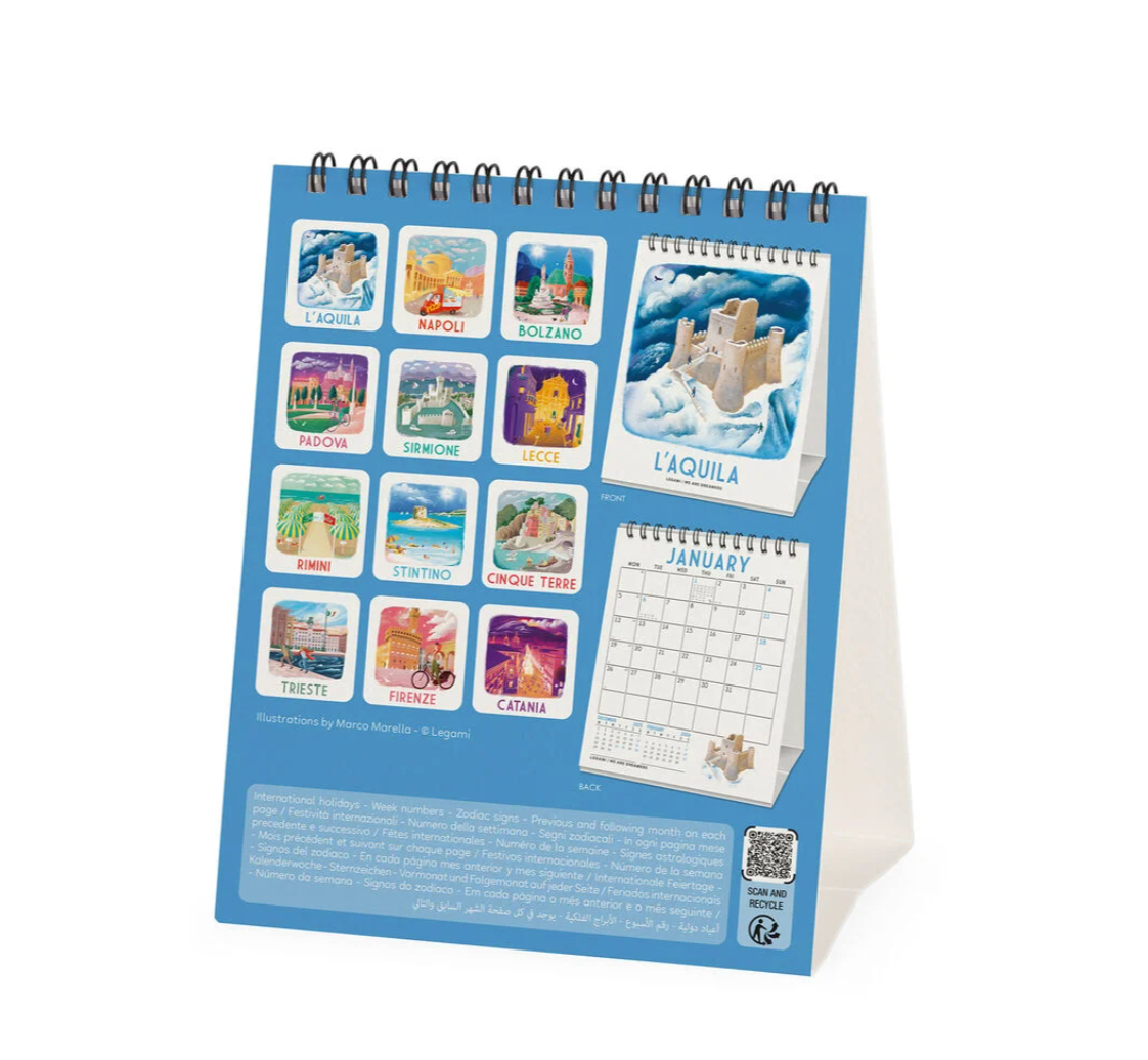 Small desk calendar with scenic images on a white background