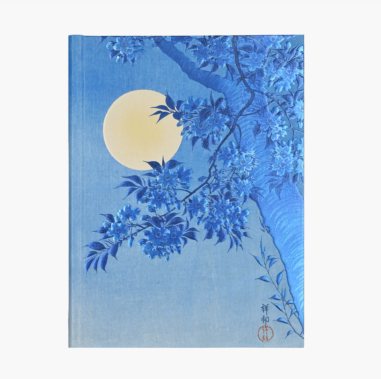 Notebook cover with blue floral design and yellow moon on a light blue background