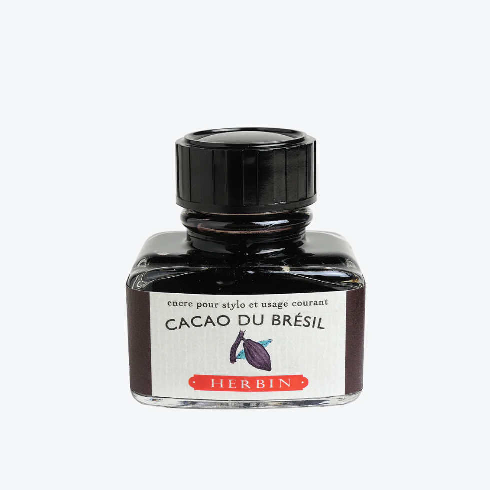 Ink bottle labeled 'Cacao du Brésil' by Herbin on a white background