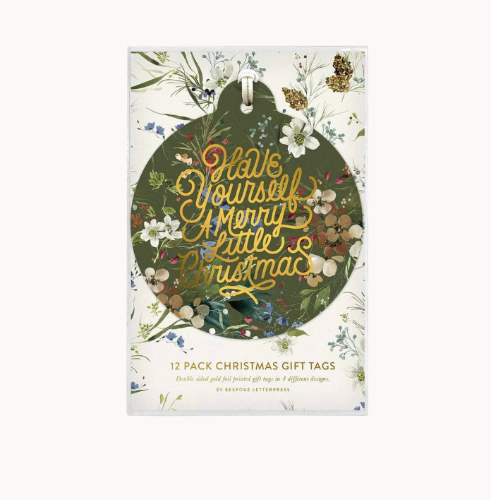 Pack of Christmas gift tags with floral design and text on a white background