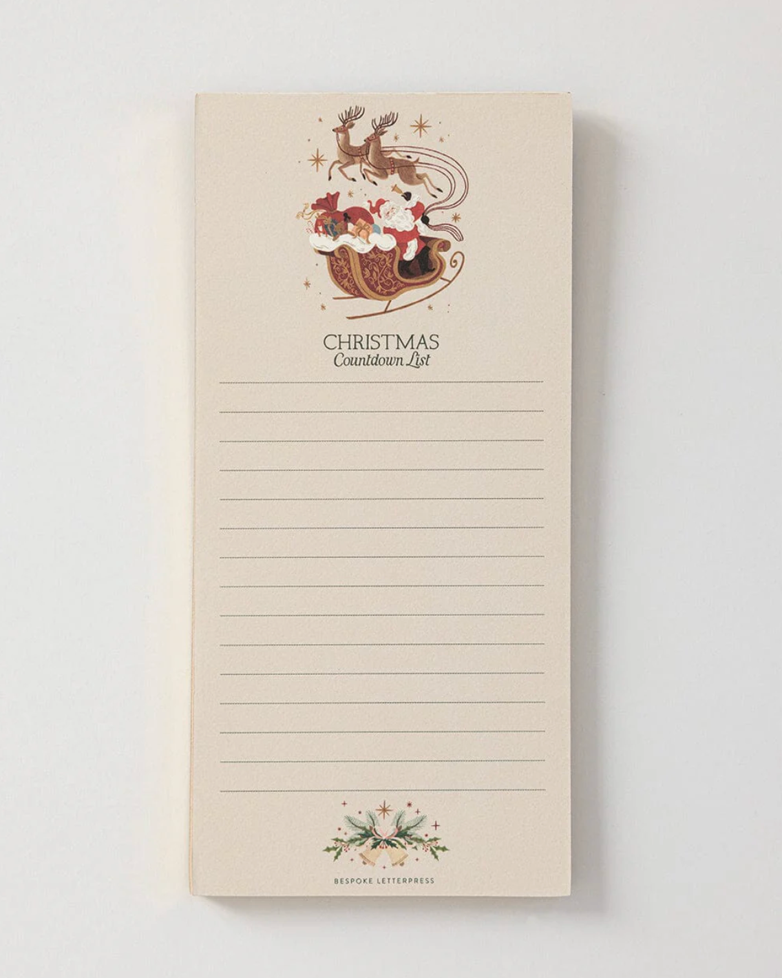 Notepad with Christmas design and text on a light background