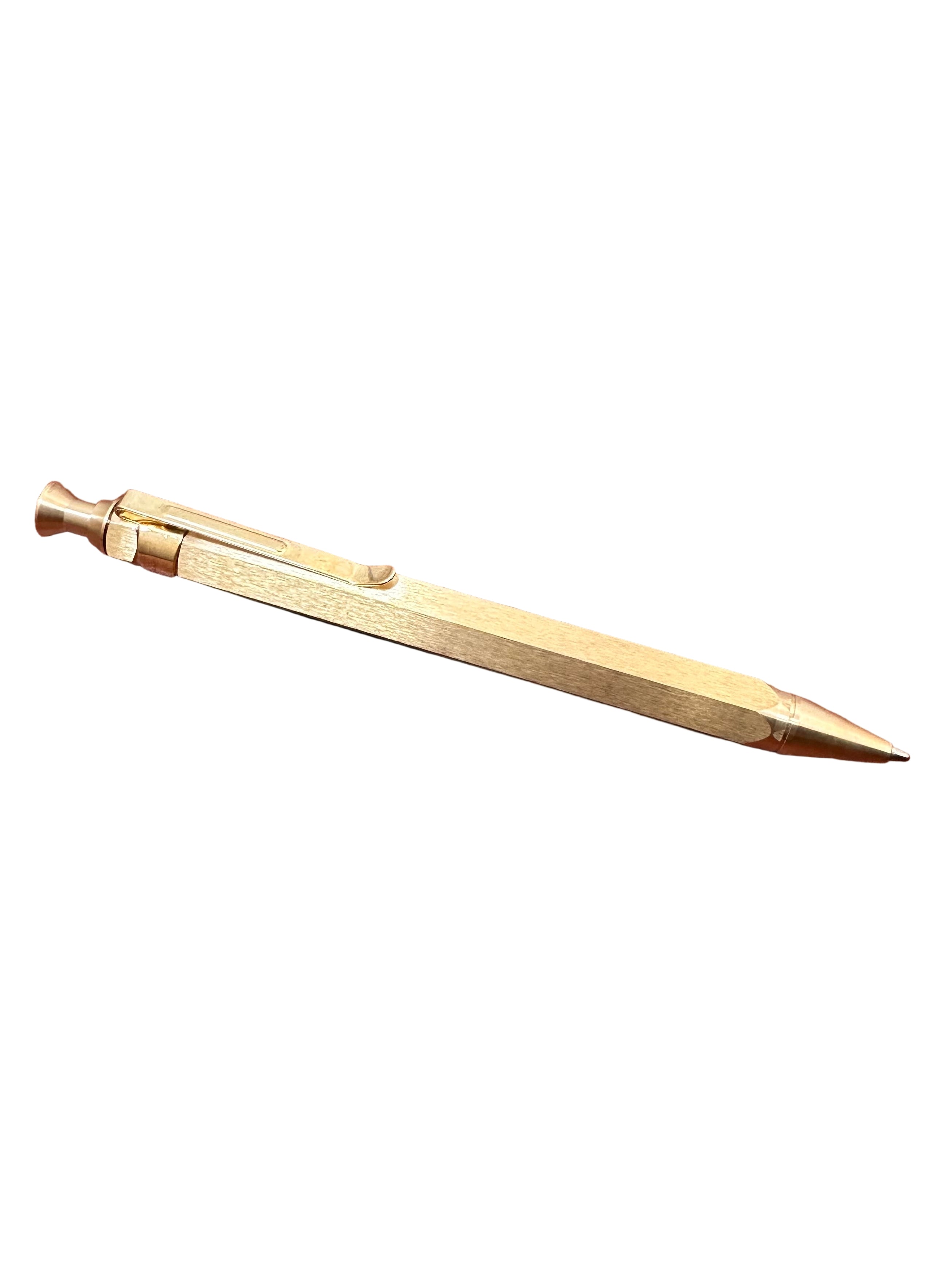 Brown leather notebook with a gold pen on a wooden surface