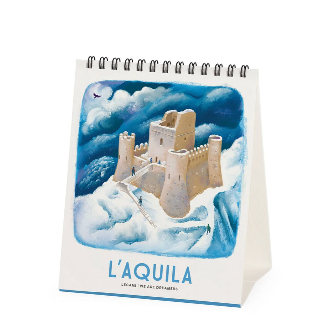 Notebook with a castle illustration and 'L'Aquila' text on a white background