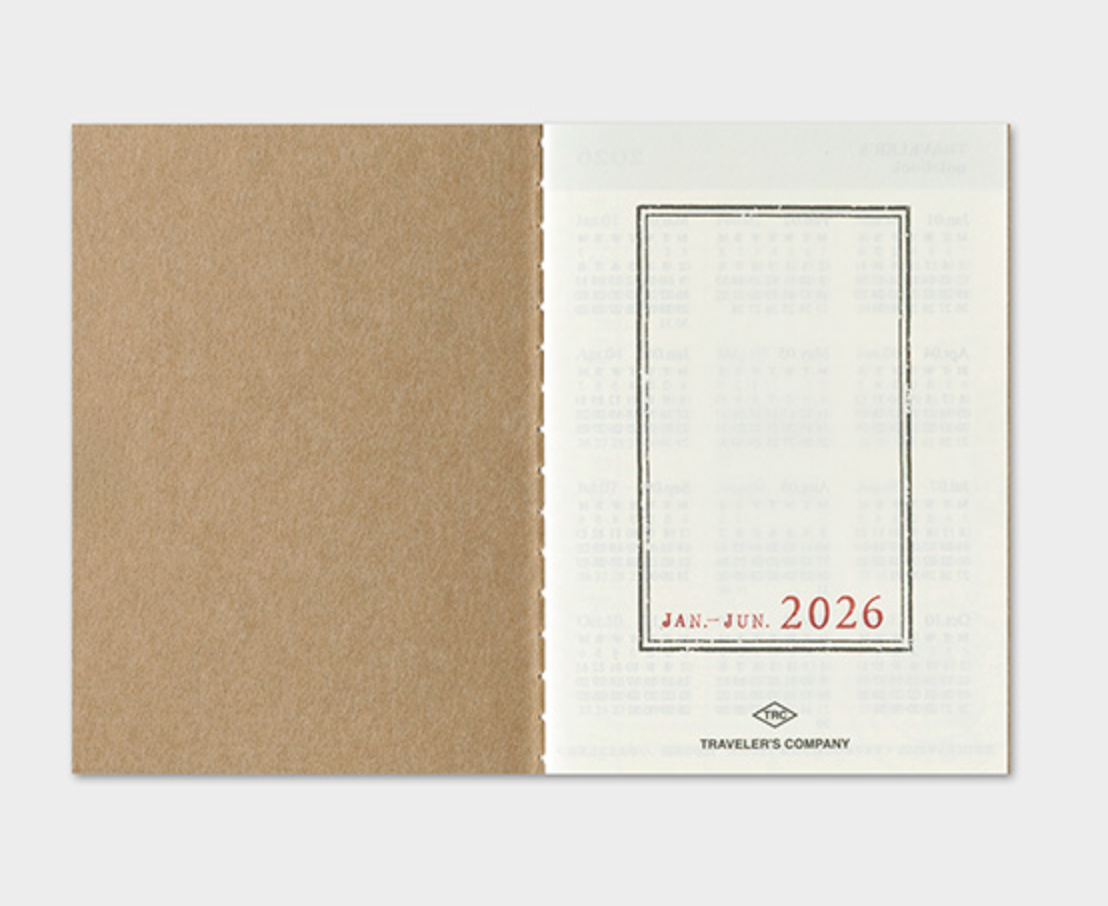 Brown notebook cover with a white slipcase featuring '2026' on a light gray background