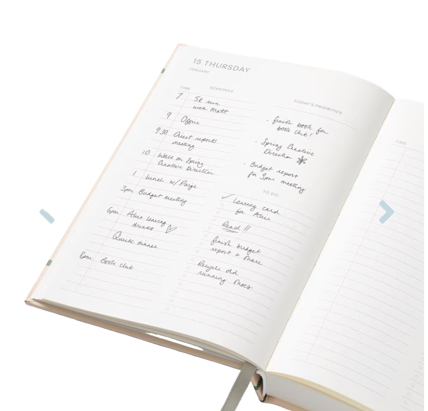 Open planner with handwritten notes on a white background