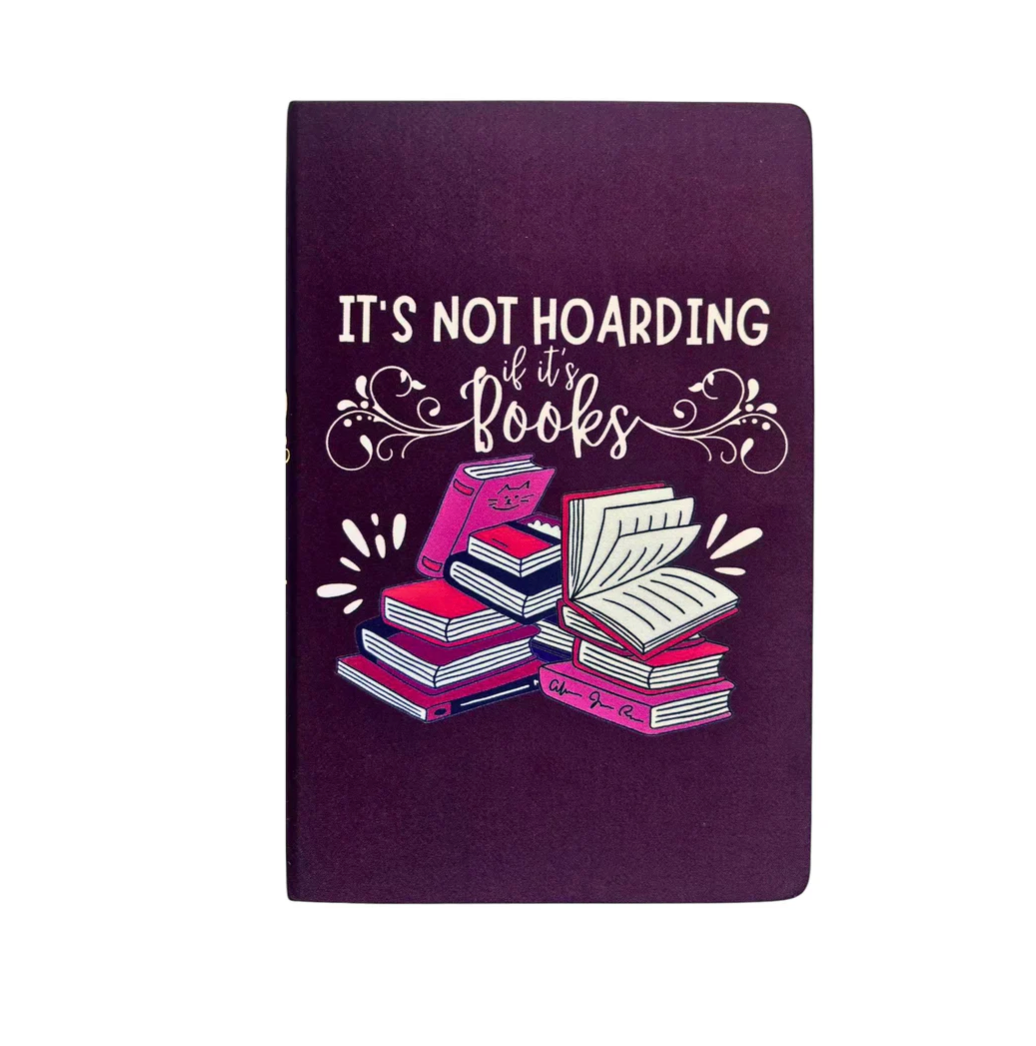 Purple notebook with book illustration and text 'It's not hoarding if it's books' on a white background