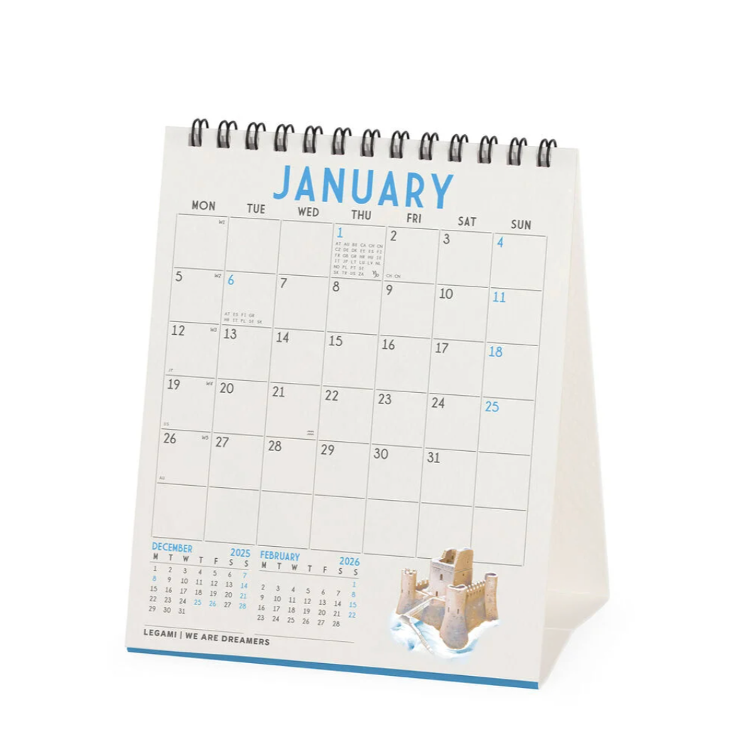 Calendar showing January with a small image of a child building a sandcastle.