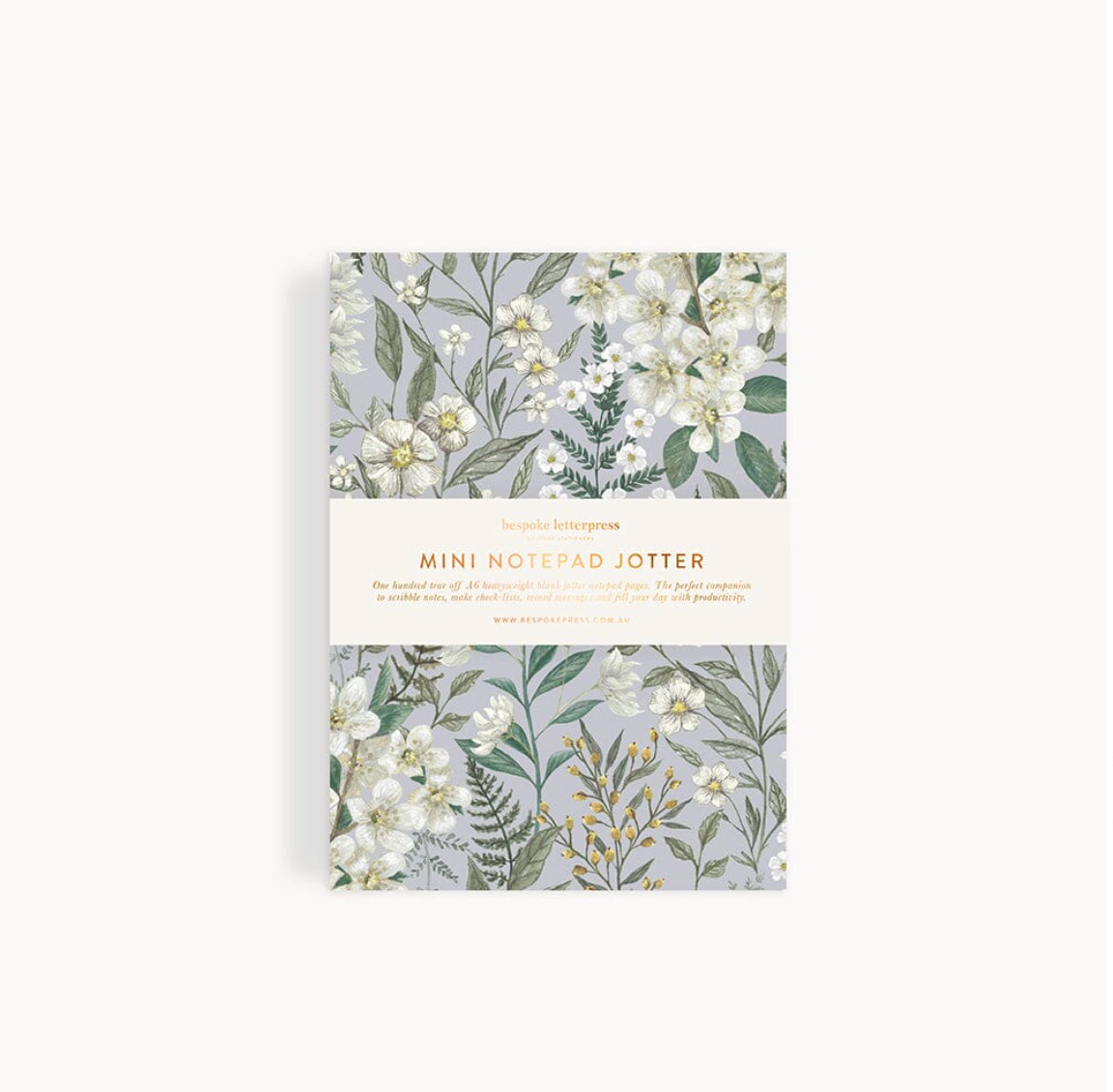 Floral patterned mini notepad on a white background