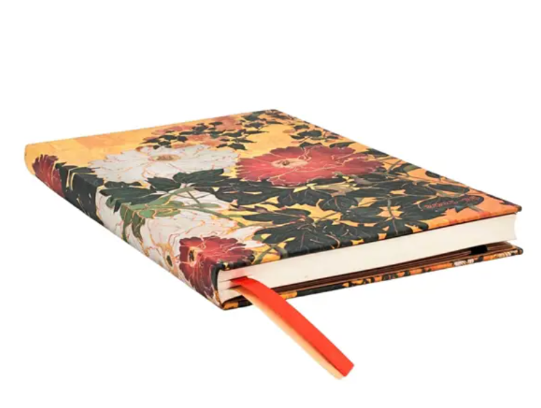 Floral-patterned planner with a red ribbon on a white background