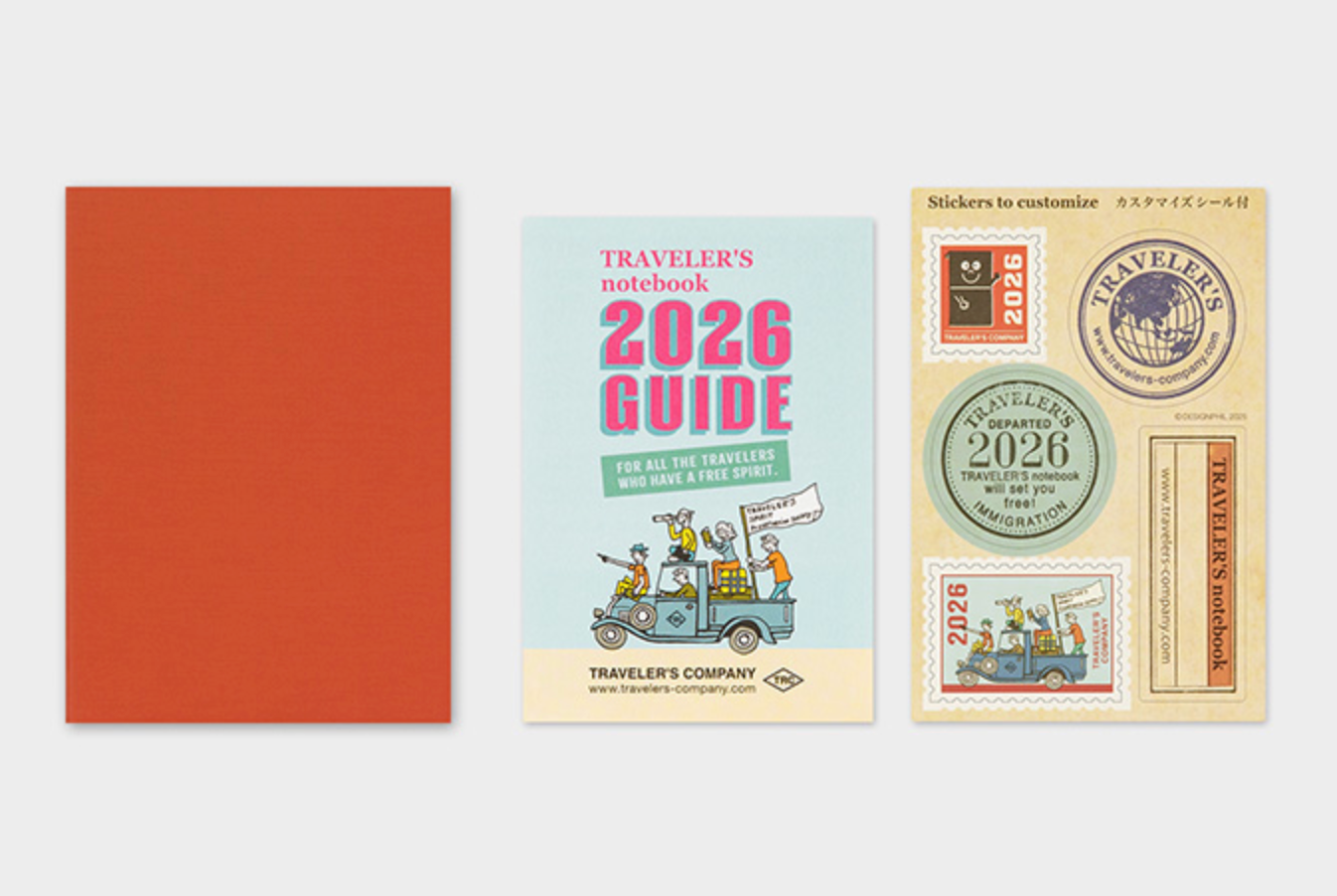 Traveler's notebook set with a red cover, guidebook, and stickers on a white background