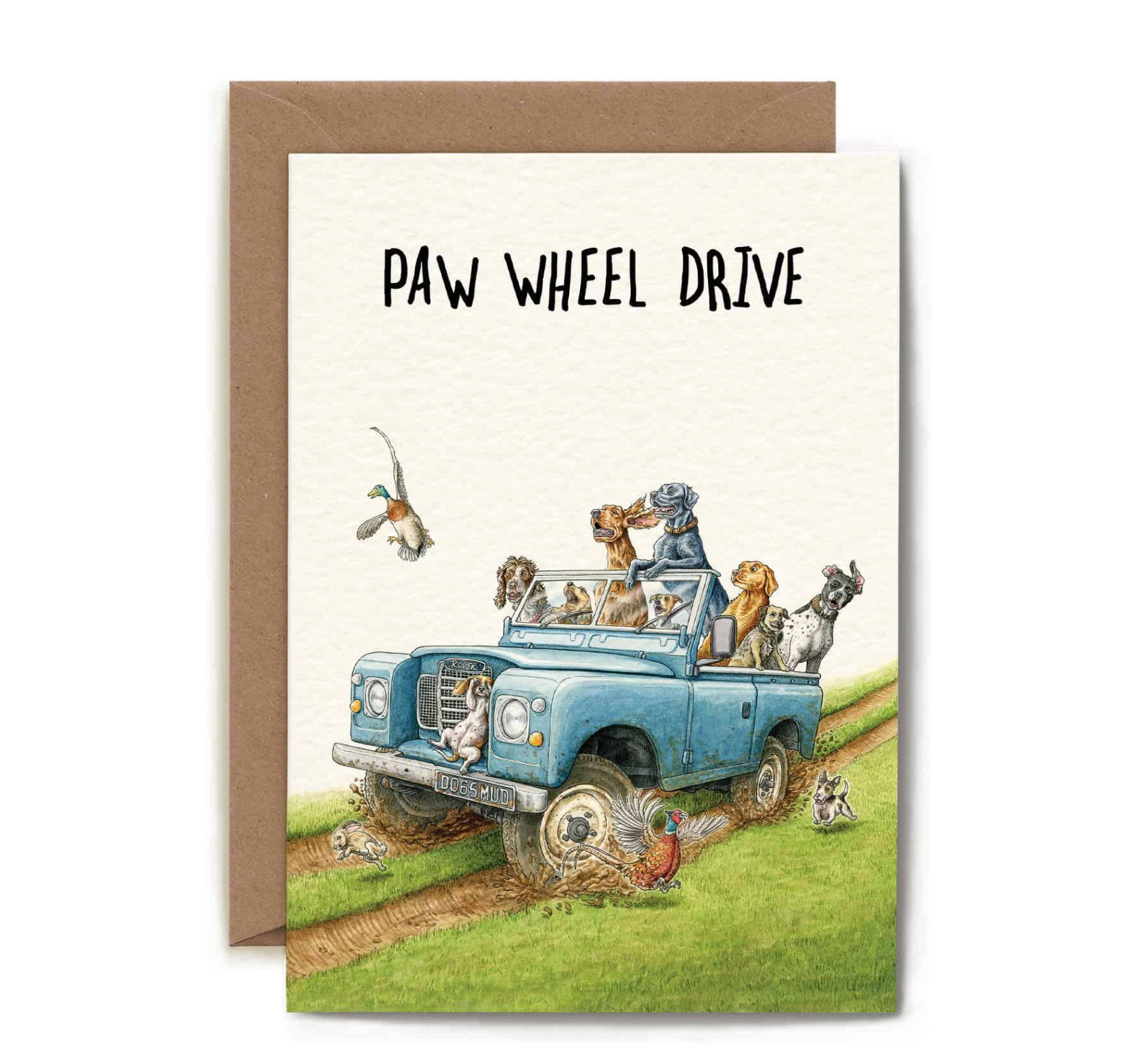 Greeting card with illustration of a blue truck carrying dogs and text 'Paw Wheel Drive' on a white background.