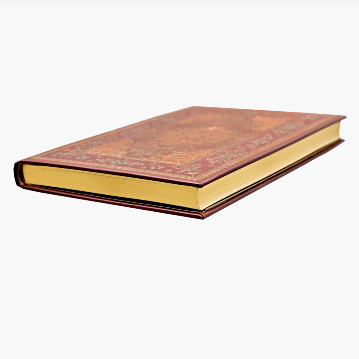 Decorative book with embossed cover on a white background