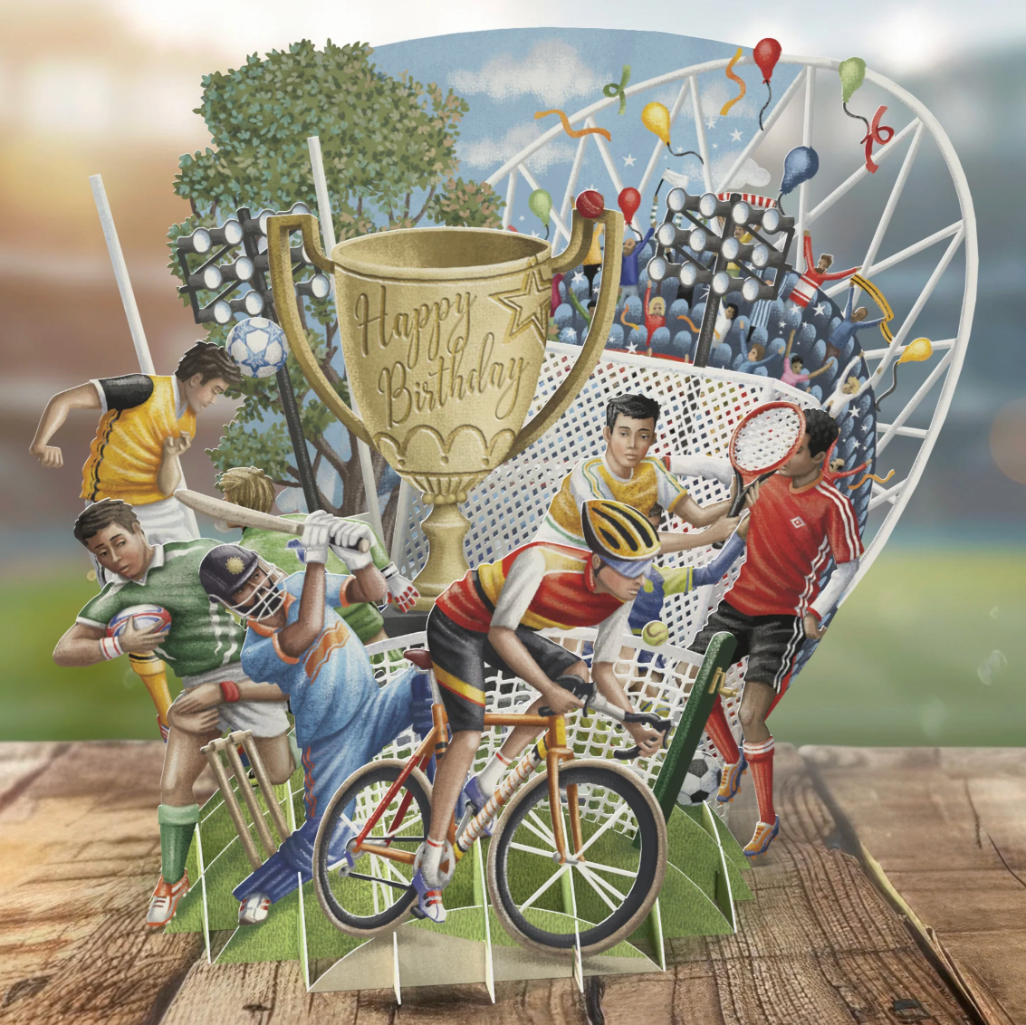 Birthday card with sports-themed design featuring children playing various sports and a large trophy.