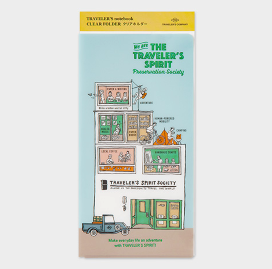 Traveler's notebook with illustration of a store front and people, on a light blue background.