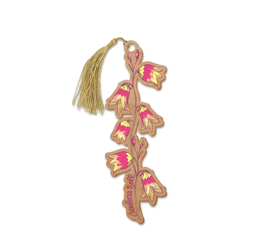Decorative bookmark with floral design and tassel on a white background
