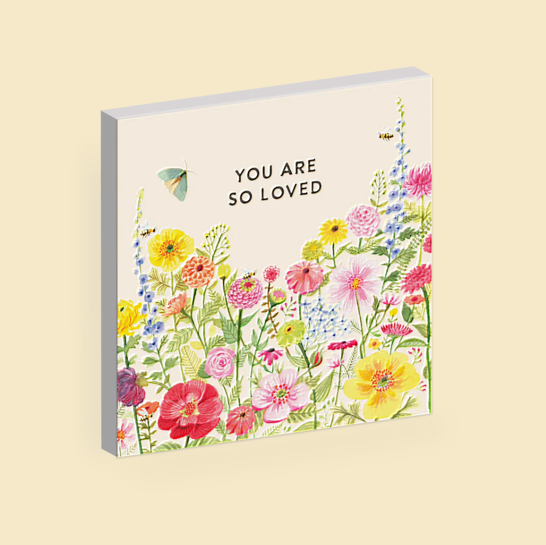 Magnet with floral design and 'You are so loved' text on a beige background