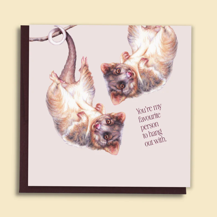 Card with two cats hanging from a branch and text 'You're my favourite person to hang out with' on a light background